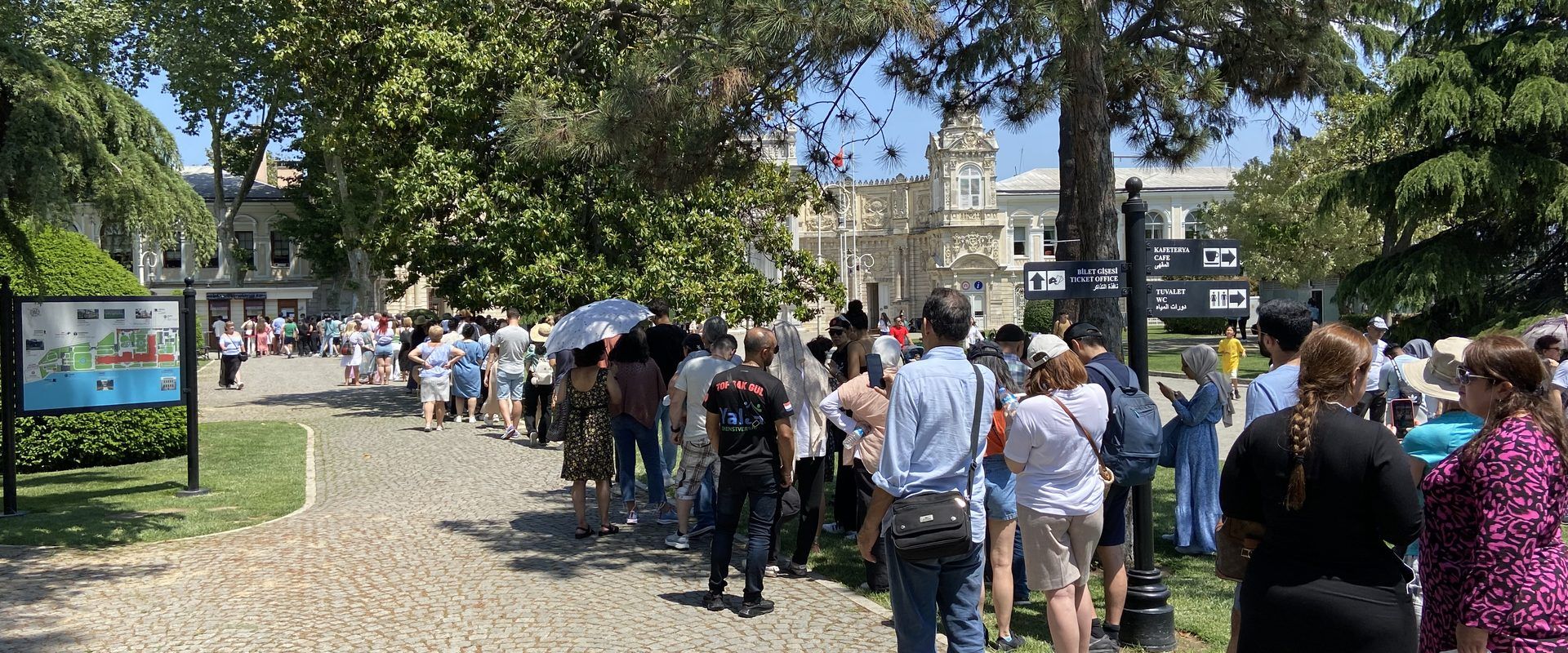 Visitors queuing through the palace gardens at Dolmabahce, Istanbul