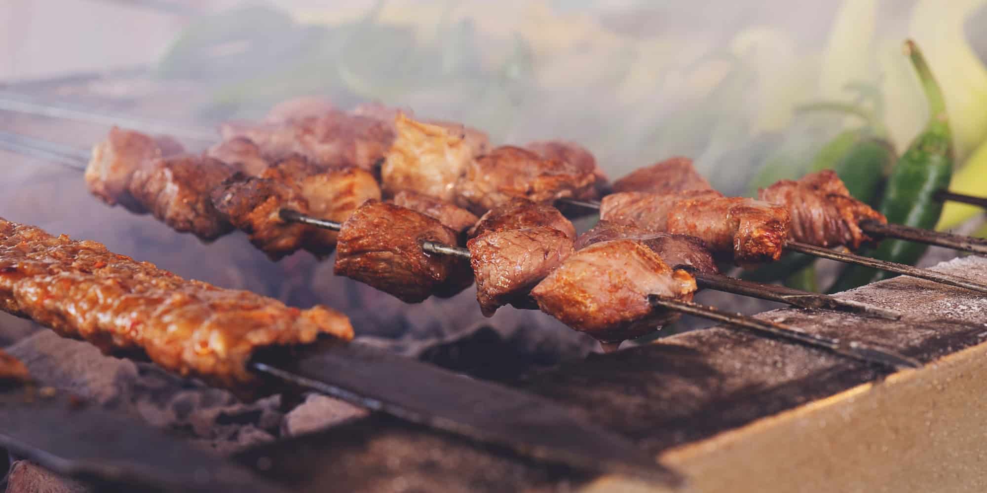 Kebab on a scewer on the grill.