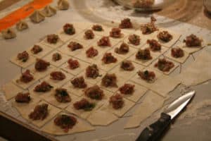 Picture of the making of mantı, also called Turkish ravioli.